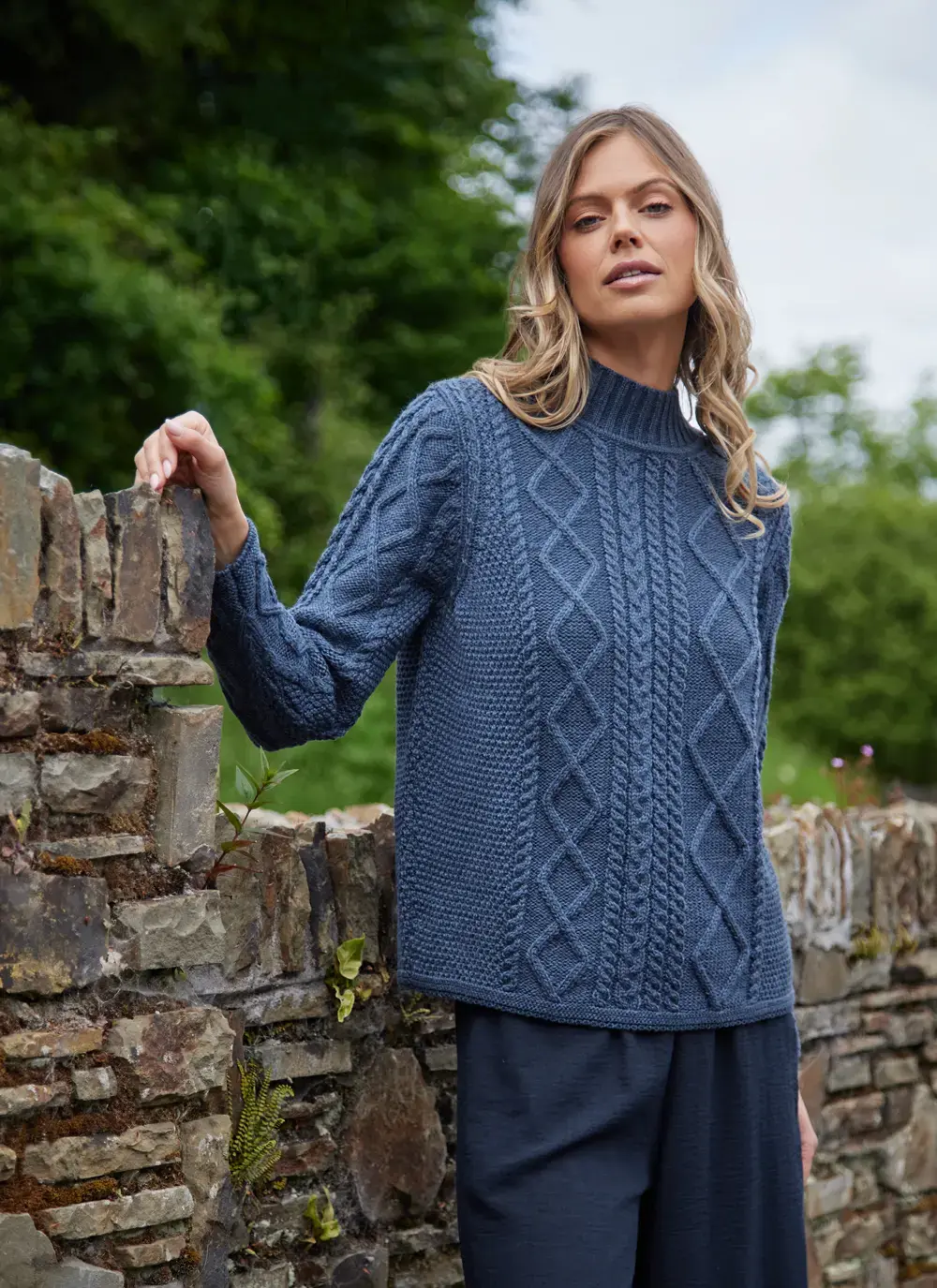 Orlaigh Aran Turtleneck in Blue Melange with diamond and cable knit detail.